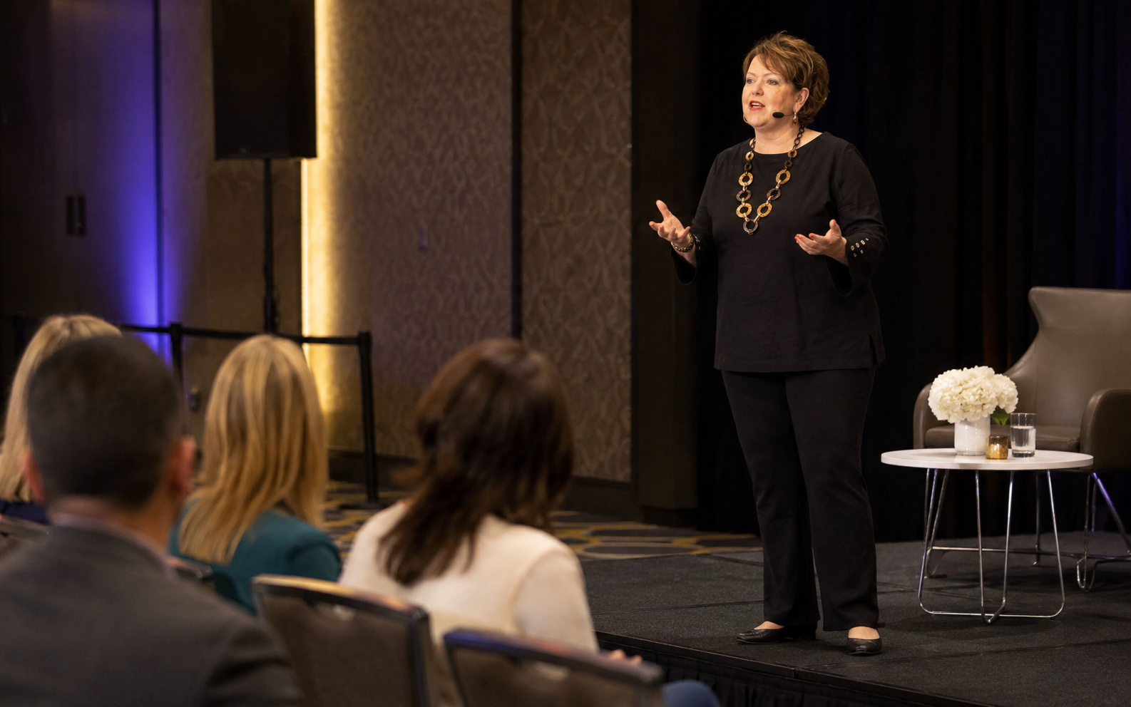 Denise Gabel speaking candidly on a conference stage